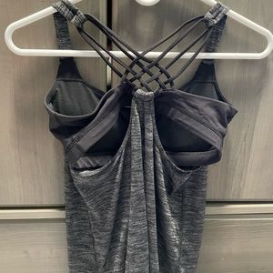 Lululemon size six. Dark gray tank top with black built in bra.
